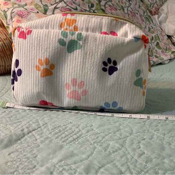 Colorful Paw Print make up bag filled with goodies - Picture 2 of 3